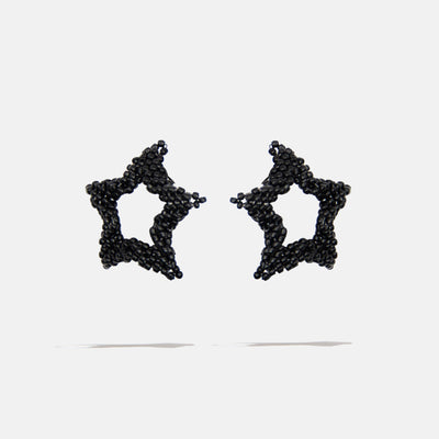 Black beaded star-shaped earrings on a white background