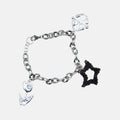 Silver bracelet with black beaded star charm on a white background