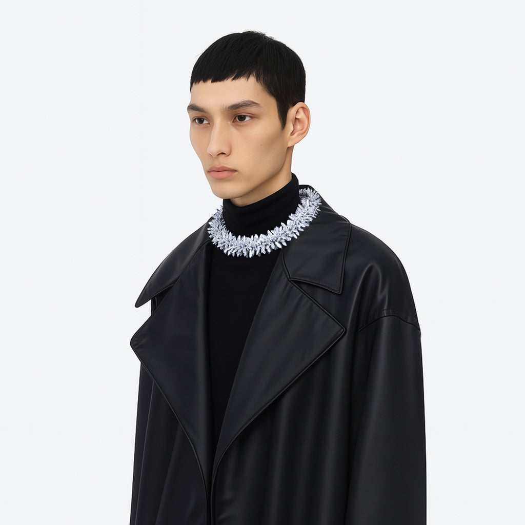 model wearing a multi beaded silver floral statement necklace on a white background