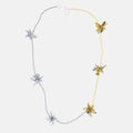 Silver and gold necklace with floral beaded pendants on a white background