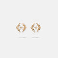 A gold coloured brass pair of logo stud fantasy earrings with floral inspired spikes, product viewed from the front