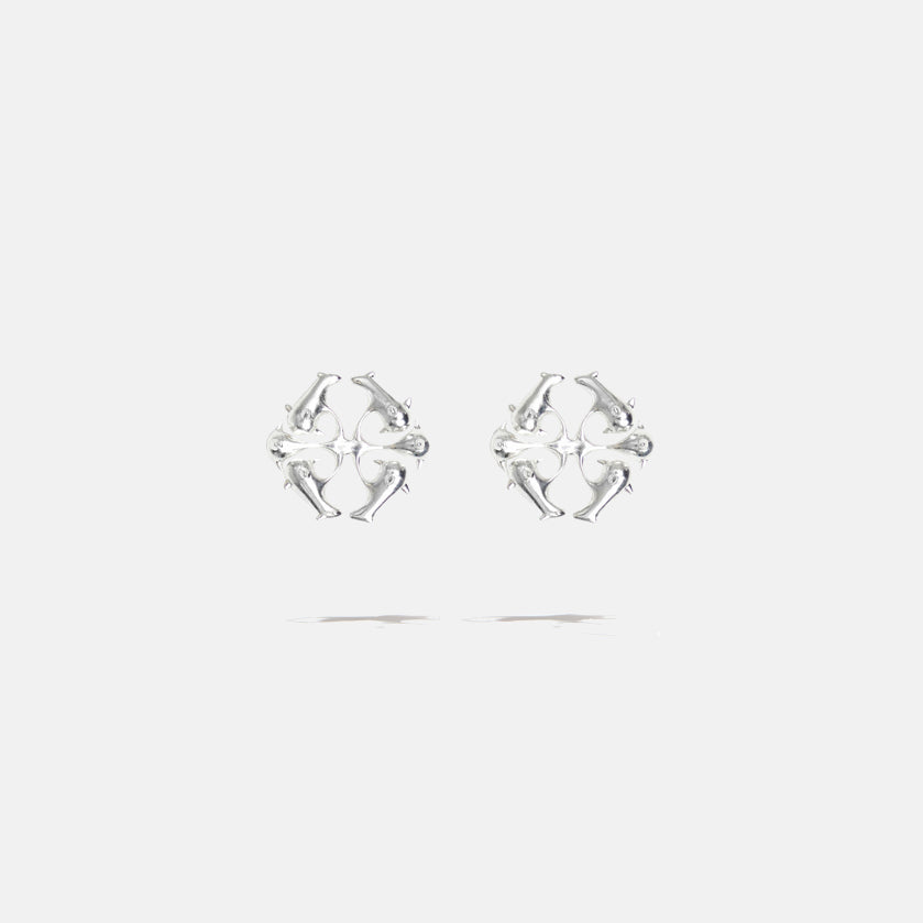 A brass silver colored pair of logo stud fantasy earrings with floral inspired spikes, product viewed from the front