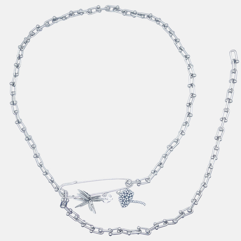 stainless steel bellychain with multi charms brooch beaded elements on a white background