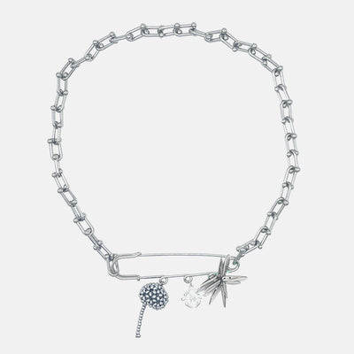 Silver necklace with beaded charms on a light gray background
