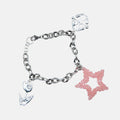 Silver bracelet with pink beaded star charm on a white background