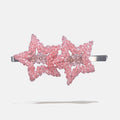 Pink beaded star-shaped hair clip on a white background