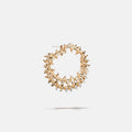A brass gold fantasy loop earring with spikes,  product viewed from the side