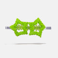 Green beaded star hair clip on a white background