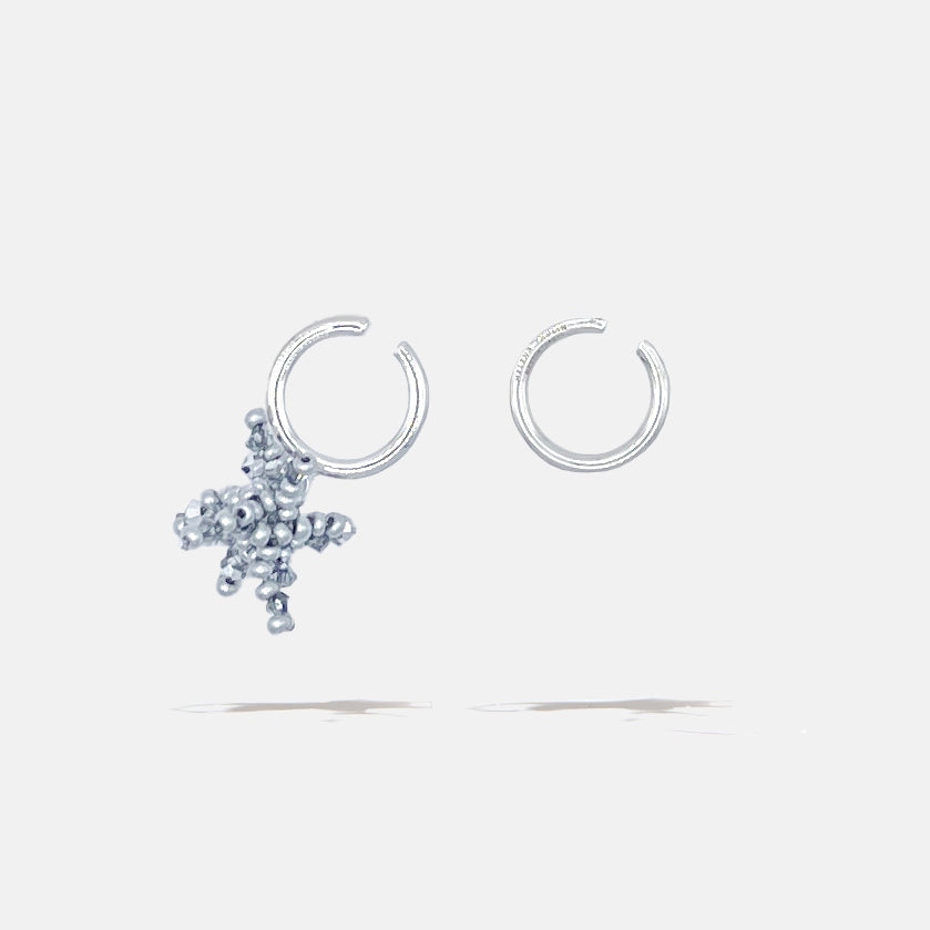 A brass silver fantasy set of earcuffs earrings with silver beaded flower, product viewed from the side