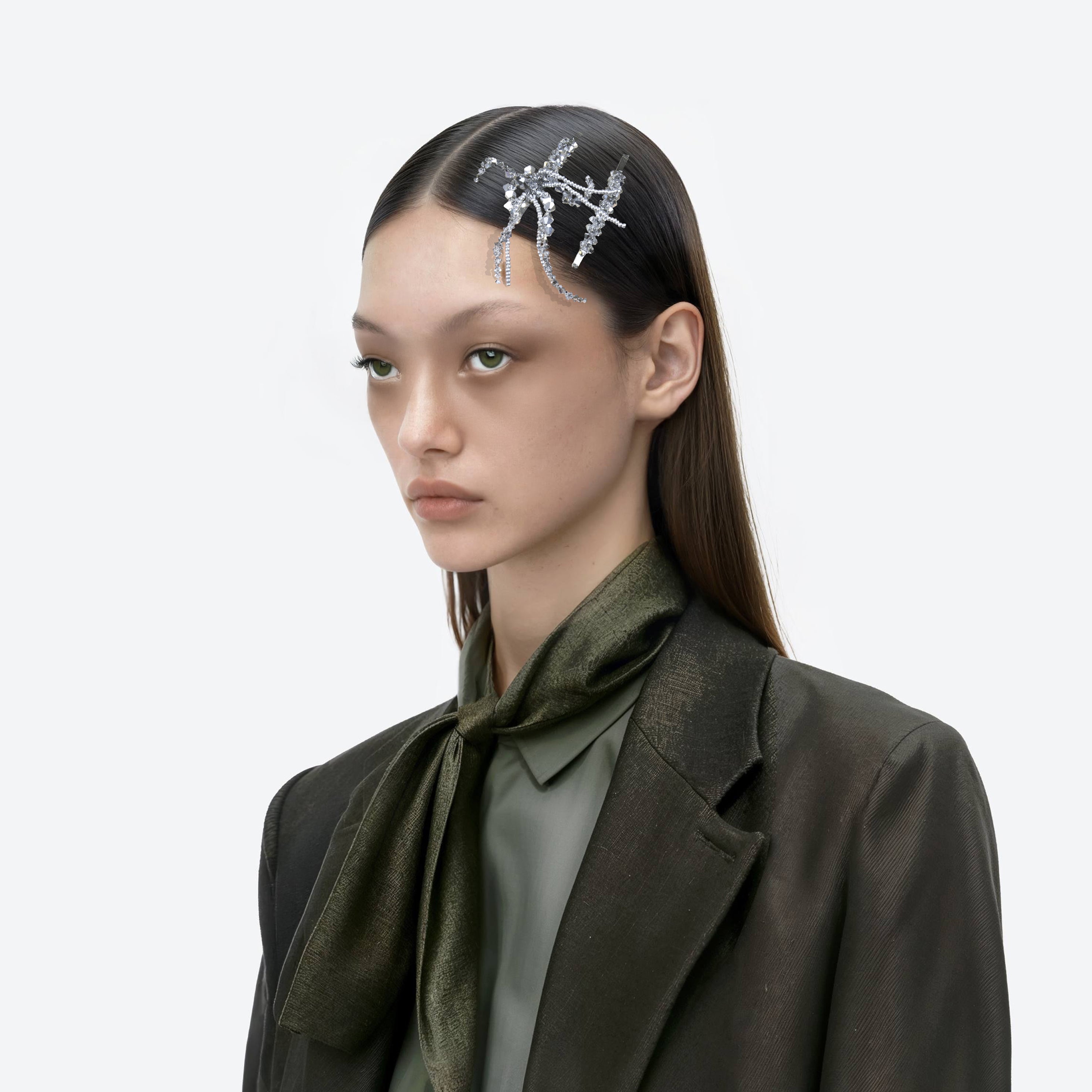 AI model wearing a set of beaded silver hairclips