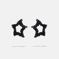Black beaded star-shaped earrings on a white background